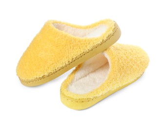 Pair of yellow soft slippers isolated on white