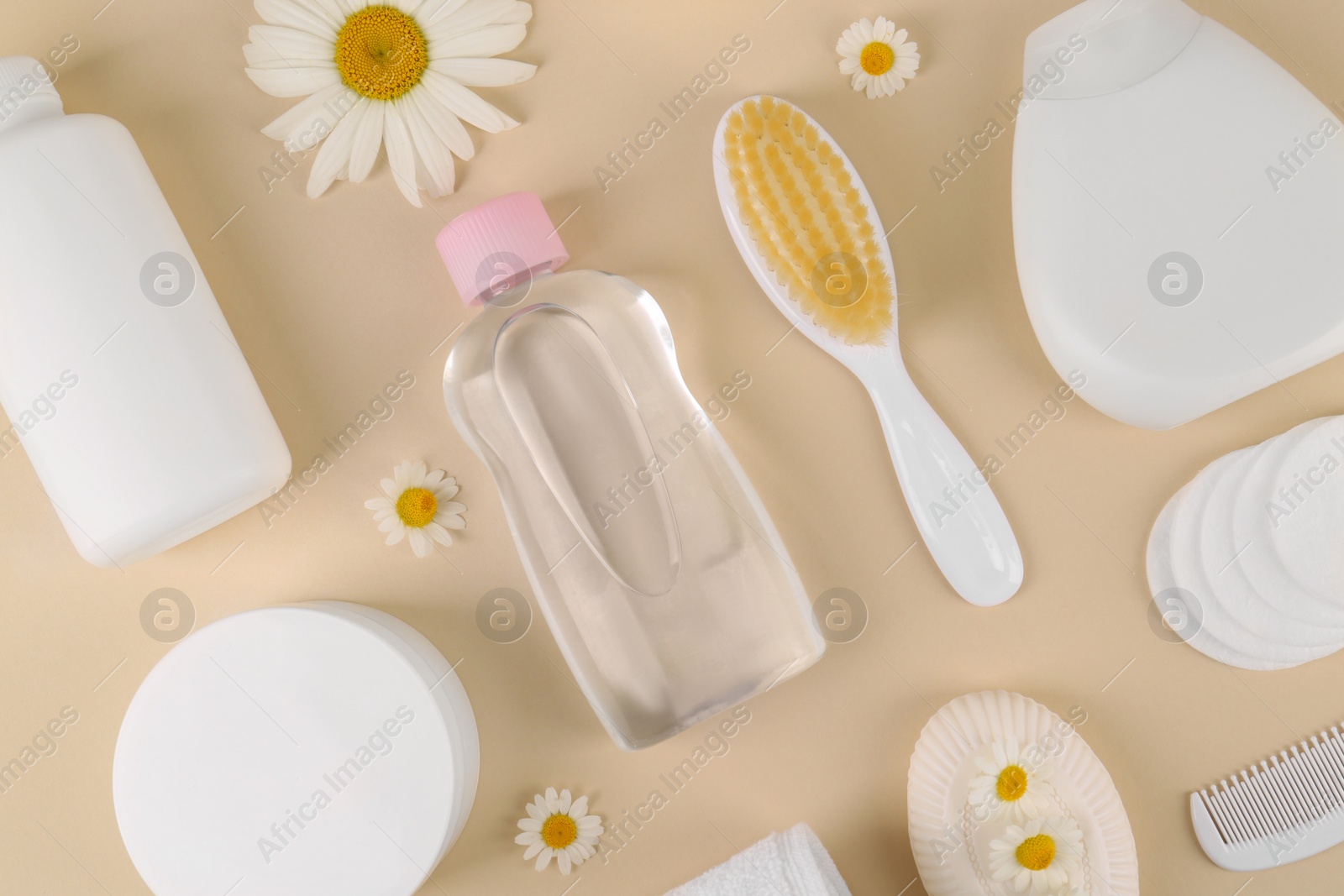 Photo of Flat lay composition with baby care products and accessories on beige background