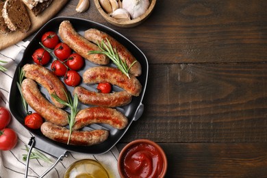 Photo of Flat lay composition with tasty homemade sausages on wooden table. Space for text