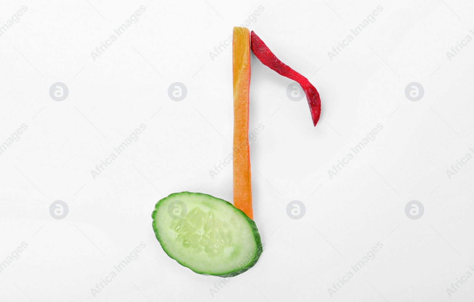 Photo of Musical note made of vegetables on white background, top view