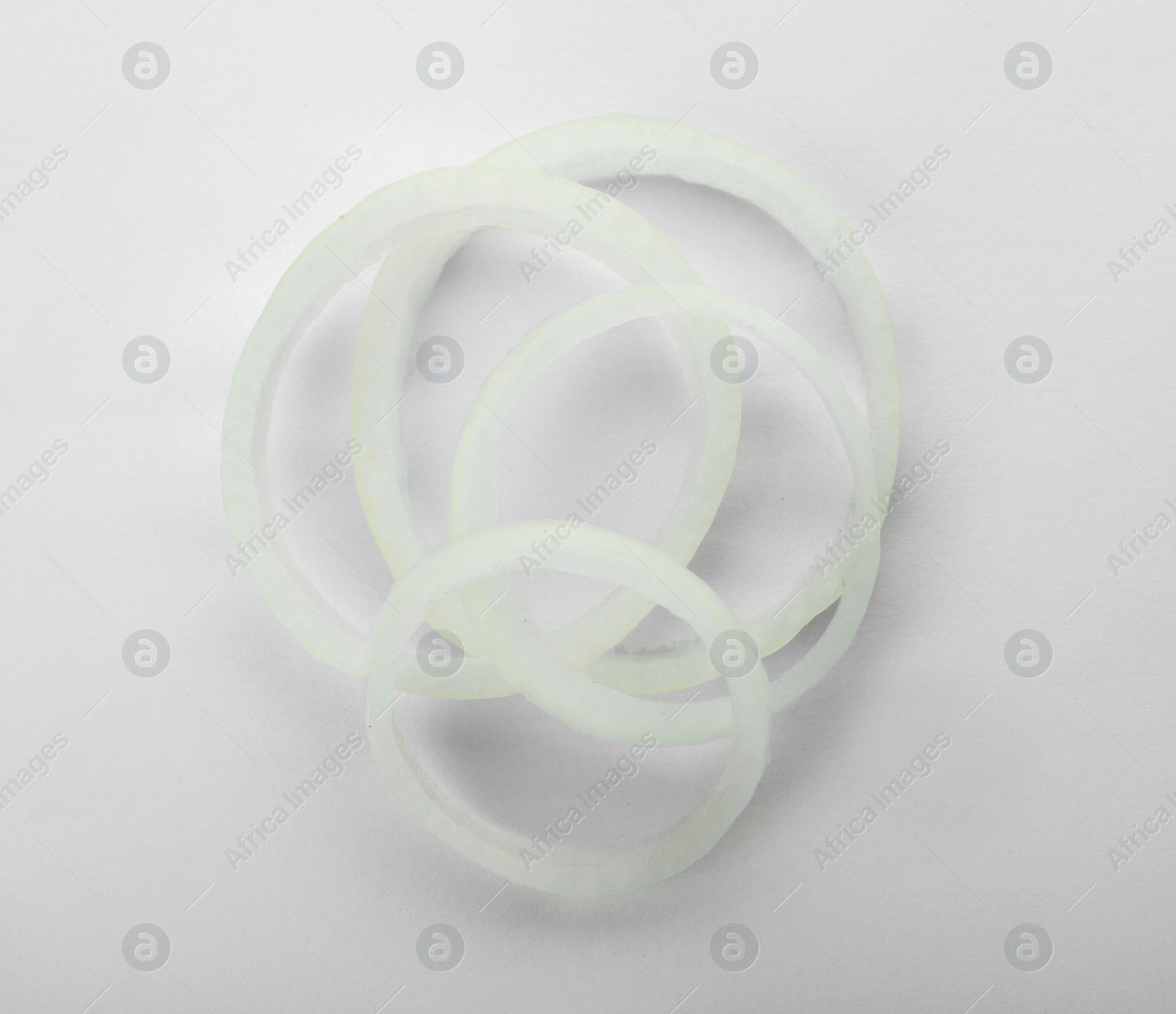 Photo of Fresh onion rings on white background