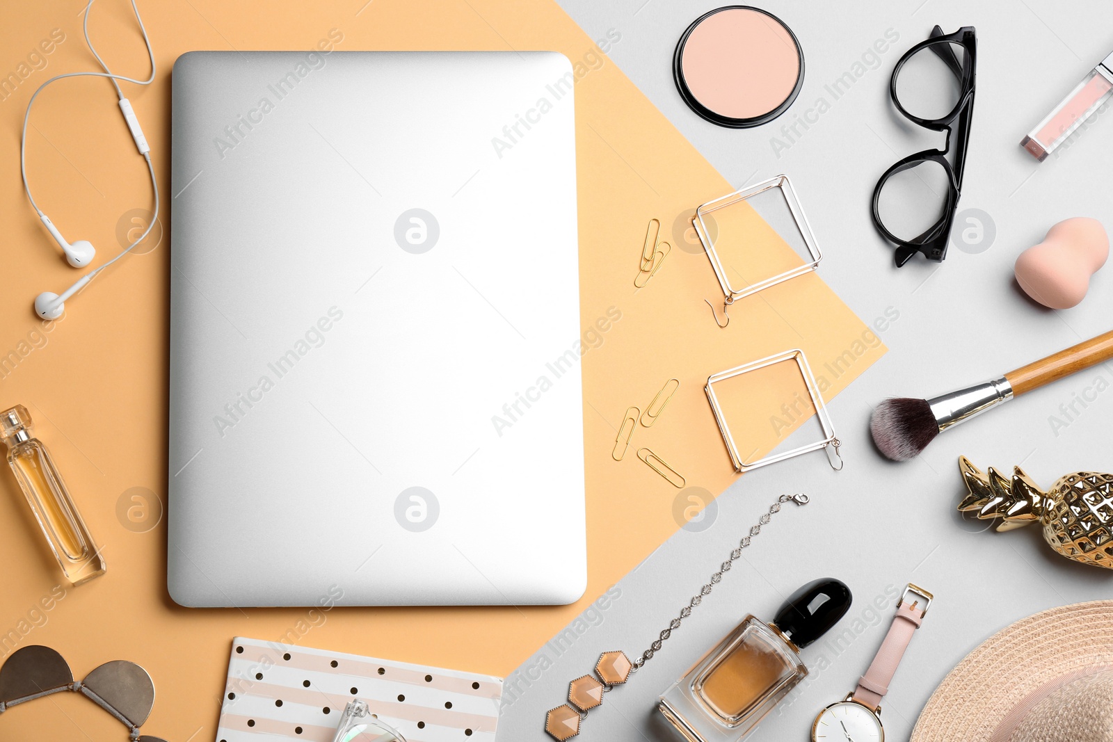 Photo of Flat lay composition with different cosmetic products and laptop on color background. Beauty blogger