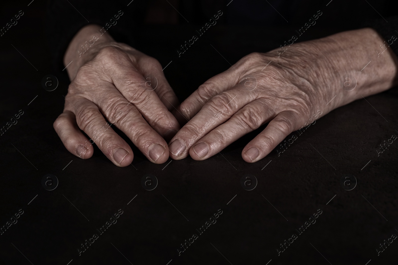 Photo of Poor mature woman at table, closeup of hands