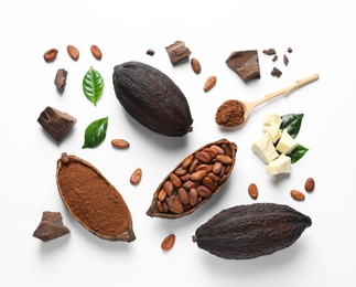 Photo of Composition with cocoa pods, powder and beans on white background, top view