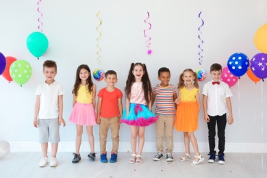 Photo of Adorable little children at birthday party indoors