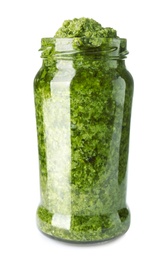 Photo of Jar of tasty pesto sauce isolated on white