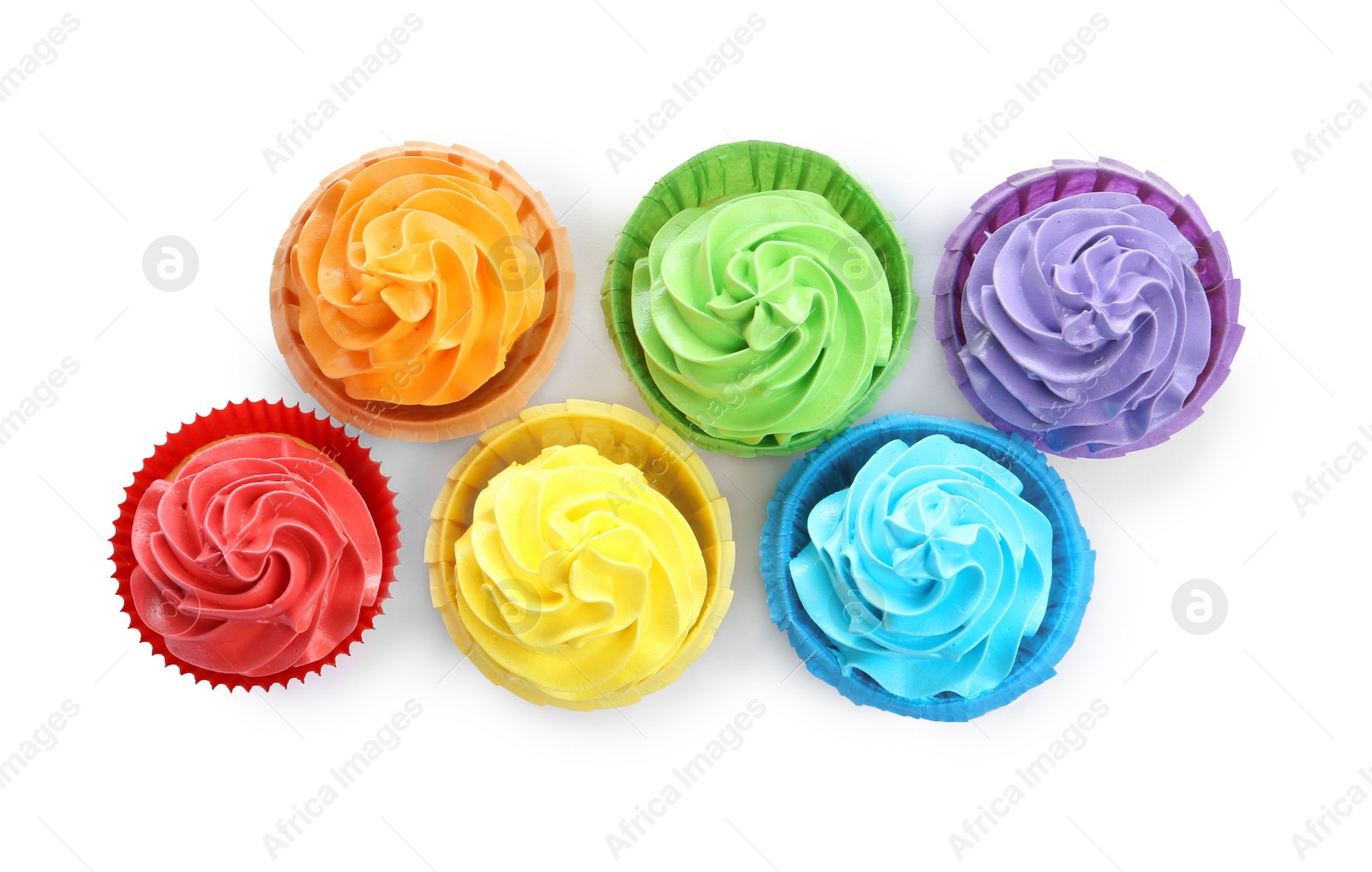 Photo of Tasty cupcakes with bright cream isolated on white, top view