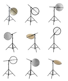 Image of Set of tripods with different reflectors on white background. Professional photographer's equipment