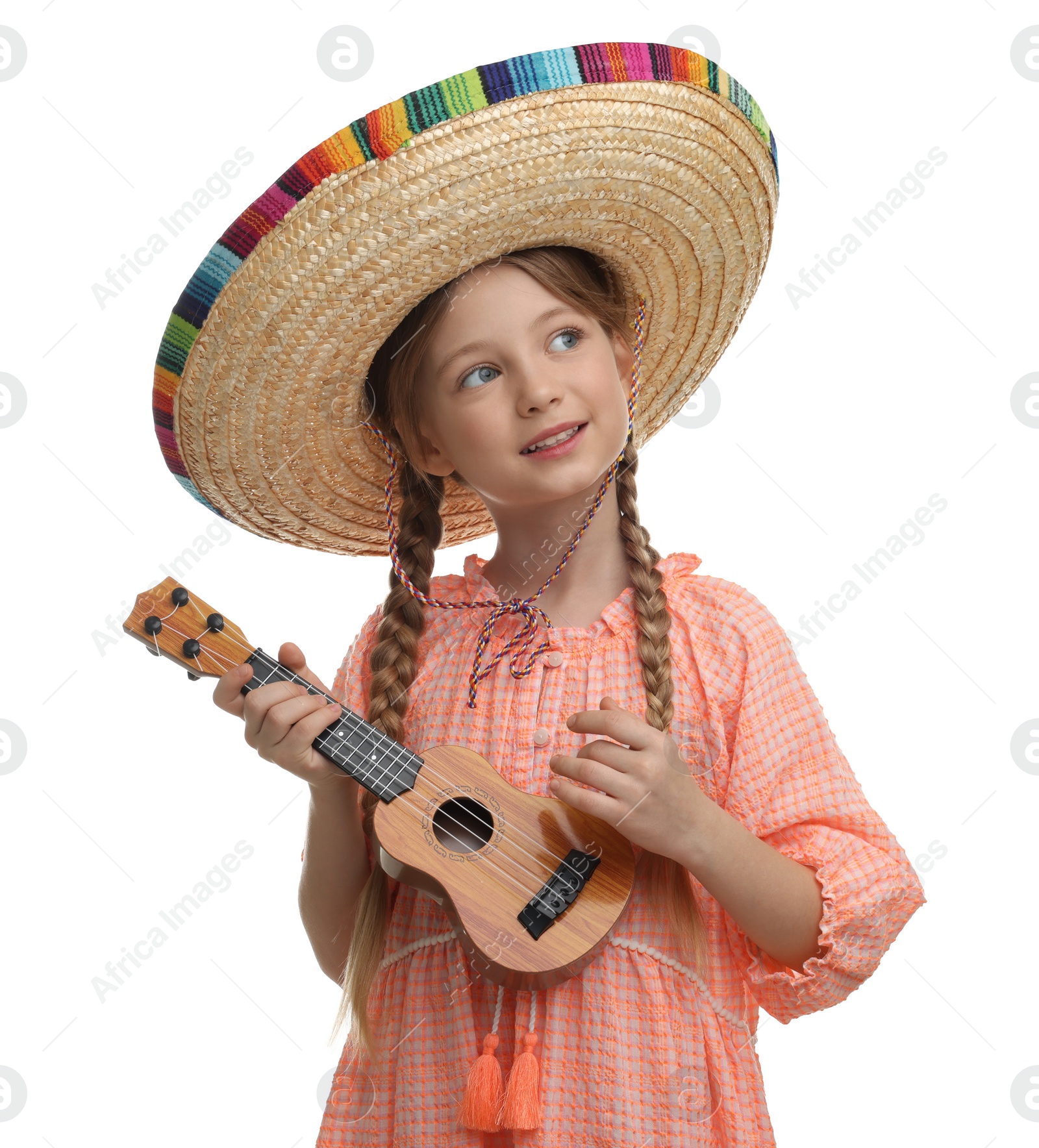 Photo of Cute girl in Mexican sombrero hat playing ukulele on white background