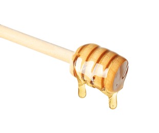 Photo of Natural honey dripping from dipper on white background