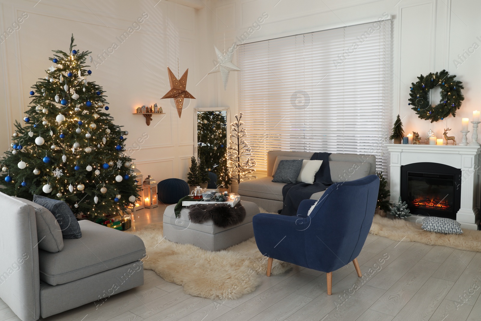 Photo of Cozy living room interior with beautiful Christmas tree and comfortable furniture