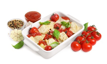Photo of Tasty ravioli with tomato sauce and different ingredients on white background
