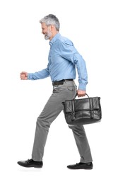 Photo of Mature businessman in stylish clothes with briefcase walking on white background