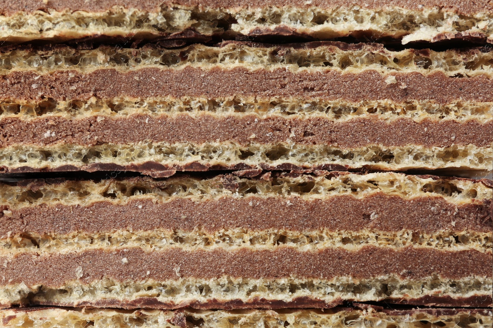 Photo of Closeup view of tasty wafer sticks as background. Sweet food