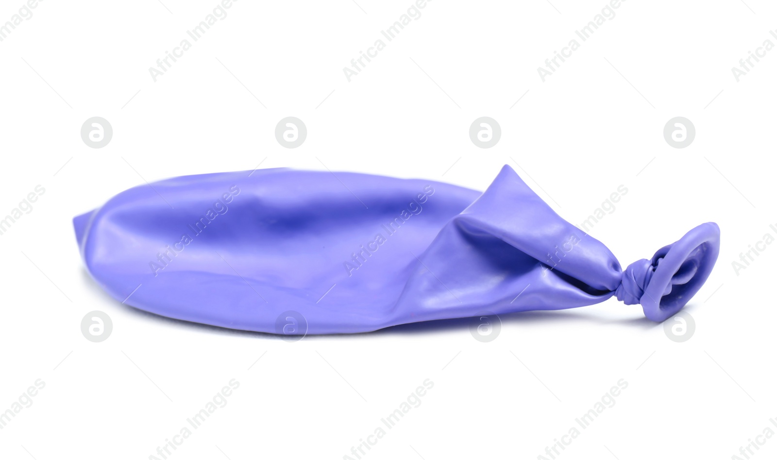 Photo of Deflated color air balloon on white background