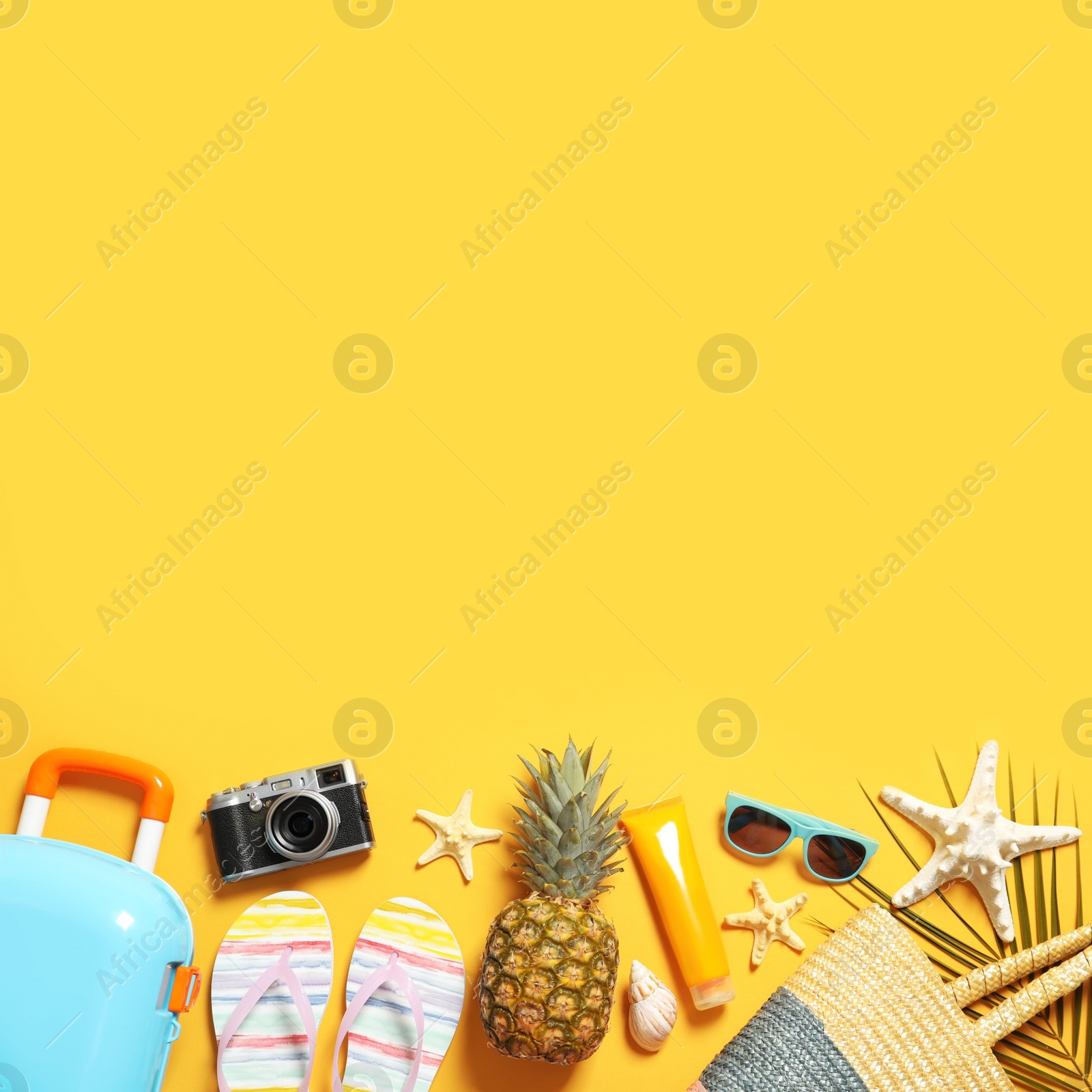 Photo of Flat lay composition with beach accessories on color background. Space for text