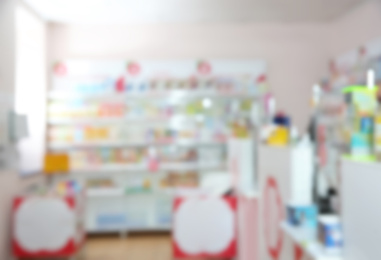 Image of Blurred view of modern pharmacy interior with different medicines