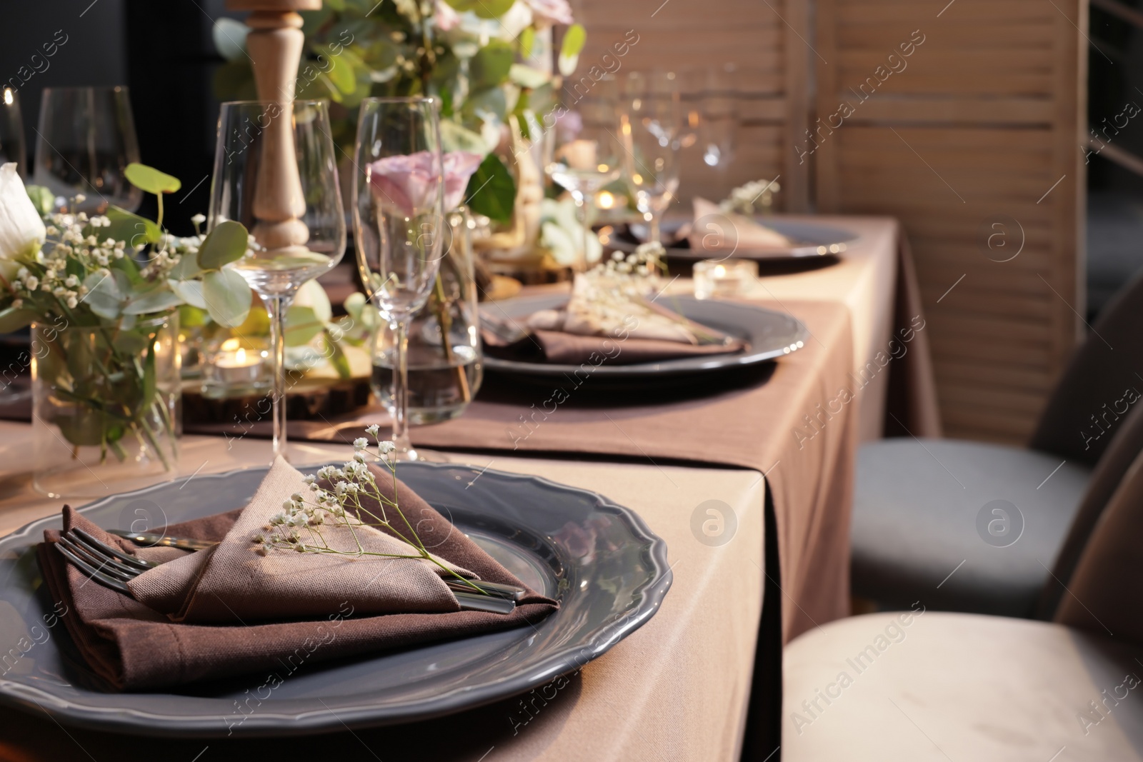 Photo of Elegant table setting with beautiful floral decor