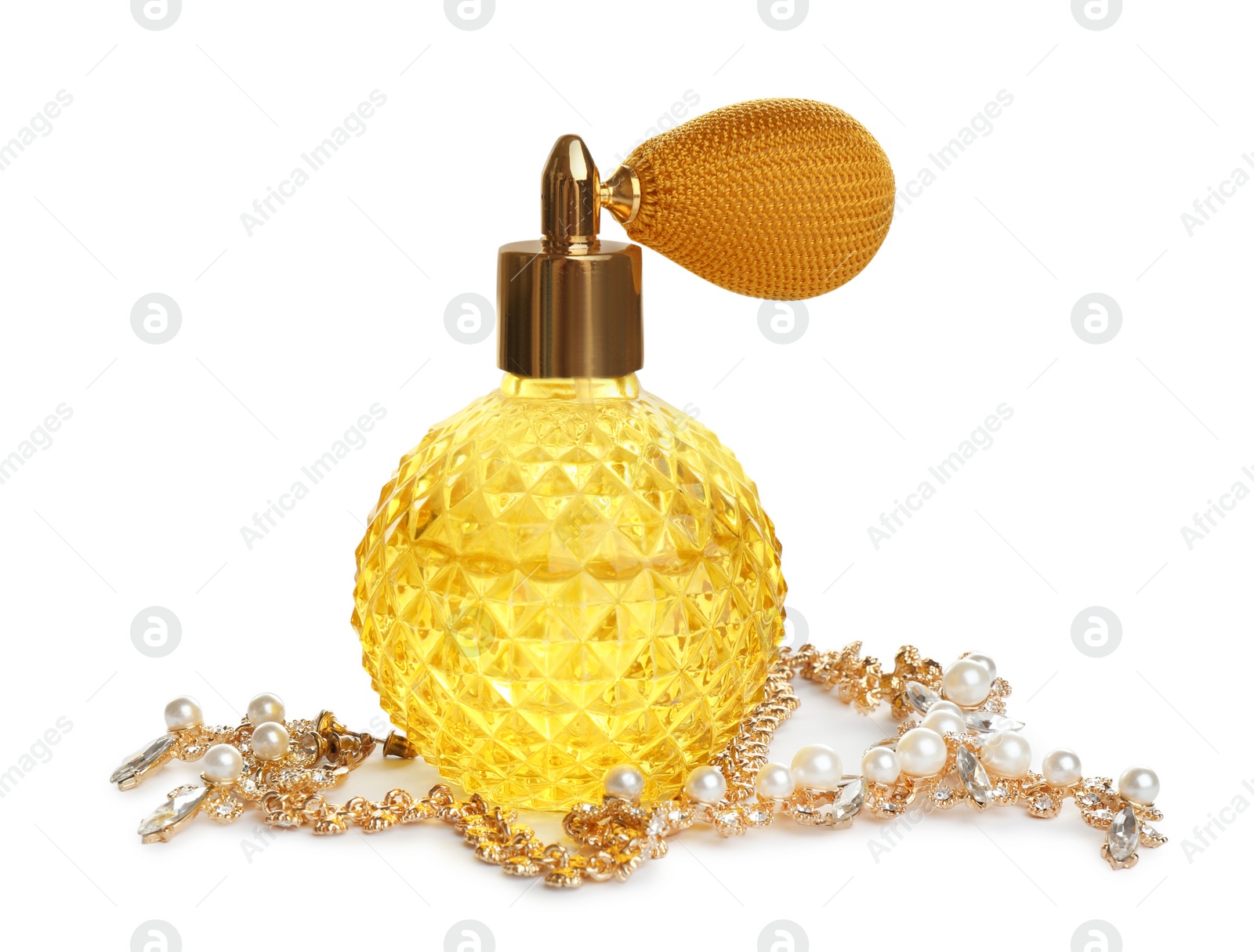 Photo of Glass bottle of perfume and luxury jewellery isolated on white