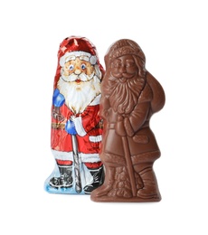 Photo of Chocolate Santa Claus candies on white background