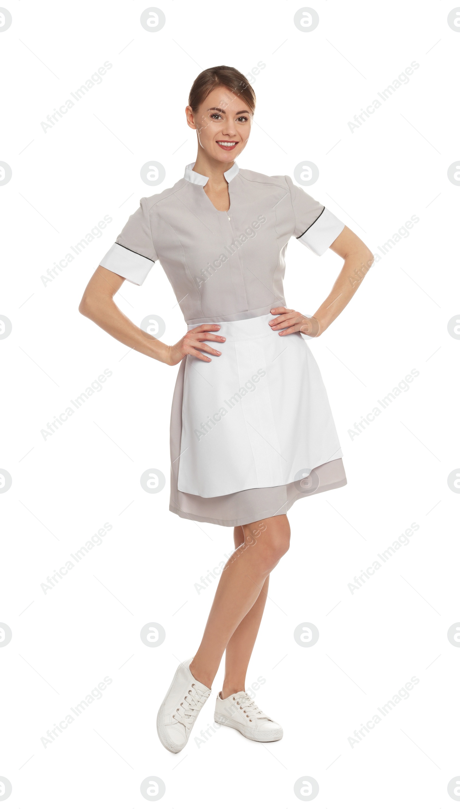 Photo of Full length portrait of chambermaid in tidy uniform on white background