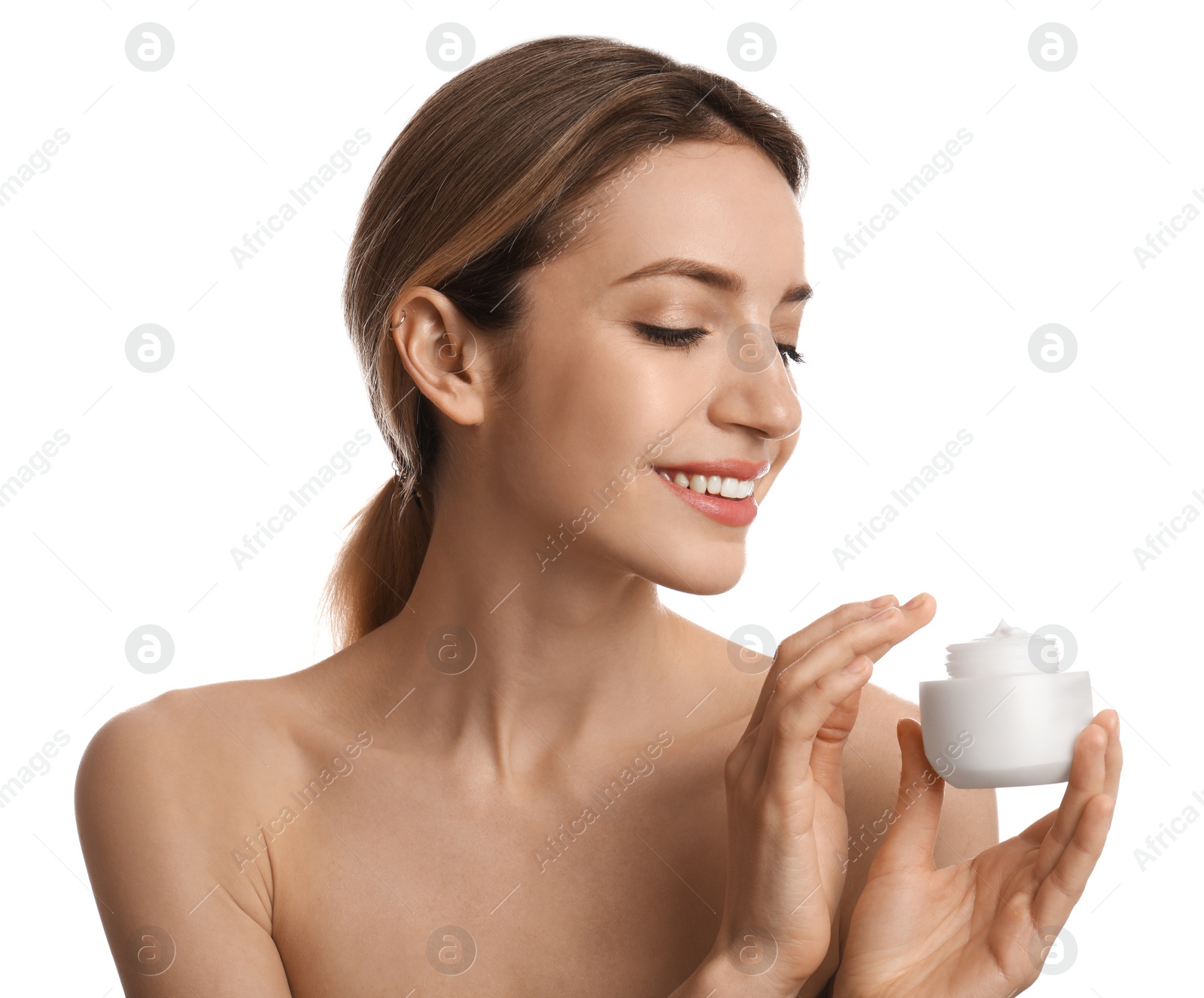 Photo of Young woman holding jar of facial cream on white background