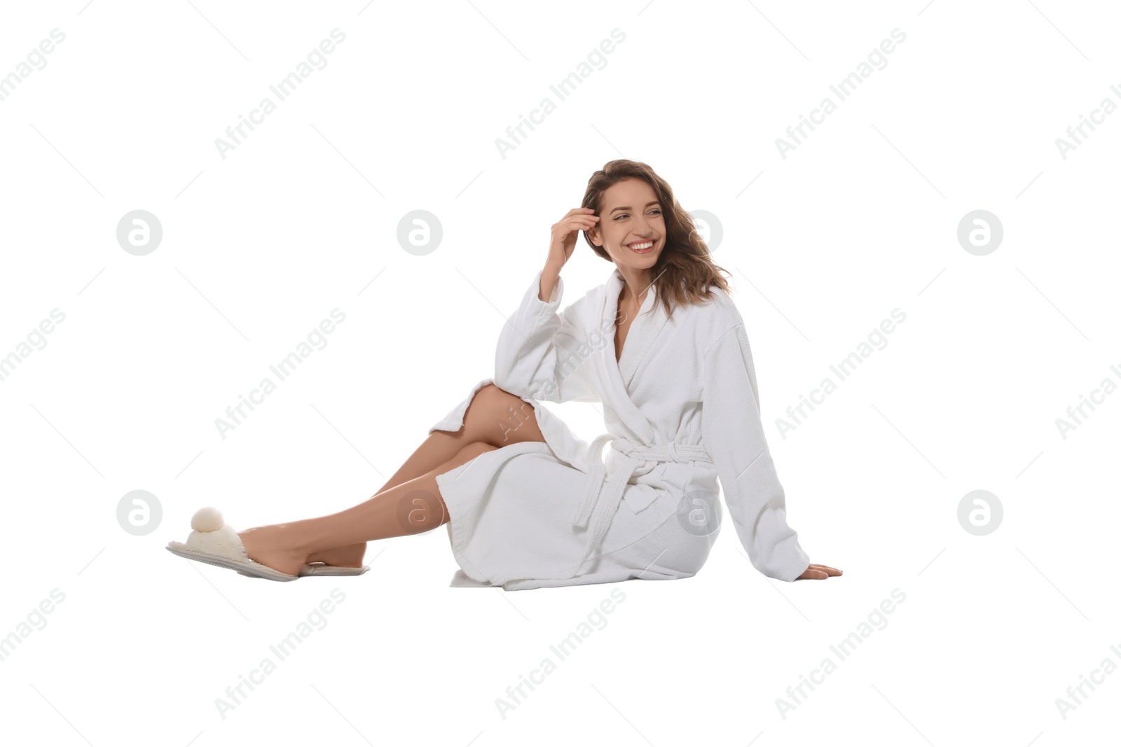 Photo of Beautiful young woman wearing bathrobe on white background