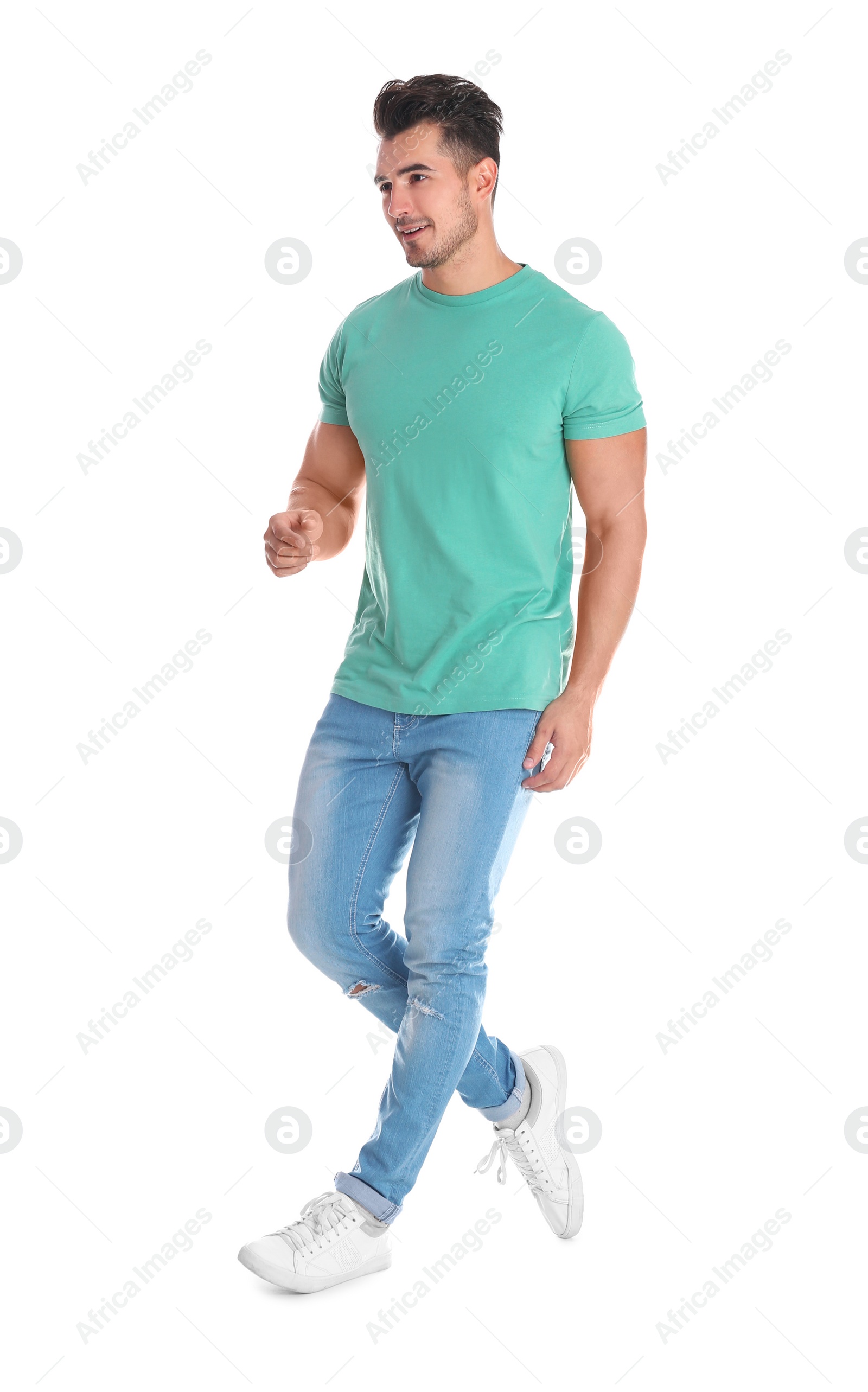 Photo of Young man in stylish jeans on white background