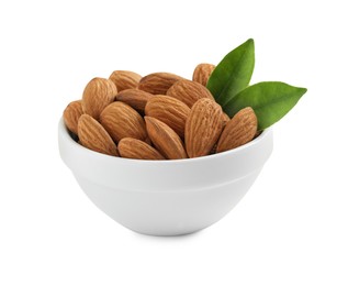 Photo of Bowl with organic almond nuts and green leaves on white background. Healthy snack