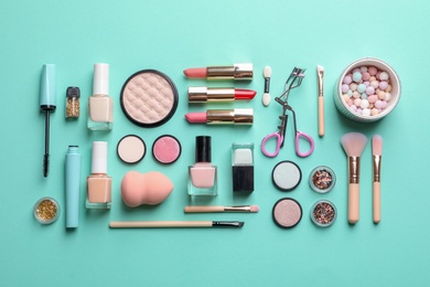 Flat lay composition with decorative cosmetics on color background