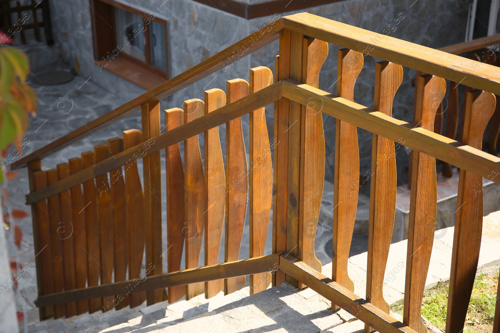 Photo of Beautiful wooden fence near stone stairs outdoors
