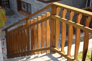 Beautiful wooden fence near stone stairs outdoors