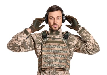 Photo of Ukrainian soldier in military uniform and active tactical headphones on white background