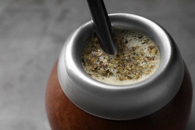 Calabash with mate tea and bombilla, closeup
