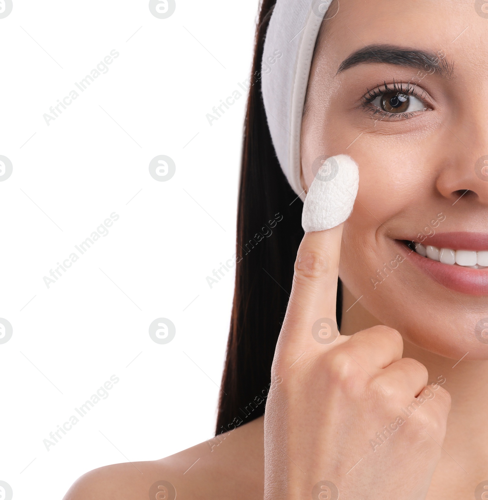 Photo of Woman using silkworm cocoon in skin care routine on white background