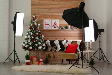 Beautiful photo zone with professional equipment and  decorated Christmas tree