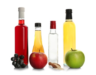 Photo of Composition with different kinds of vinegar and ingredients on white background