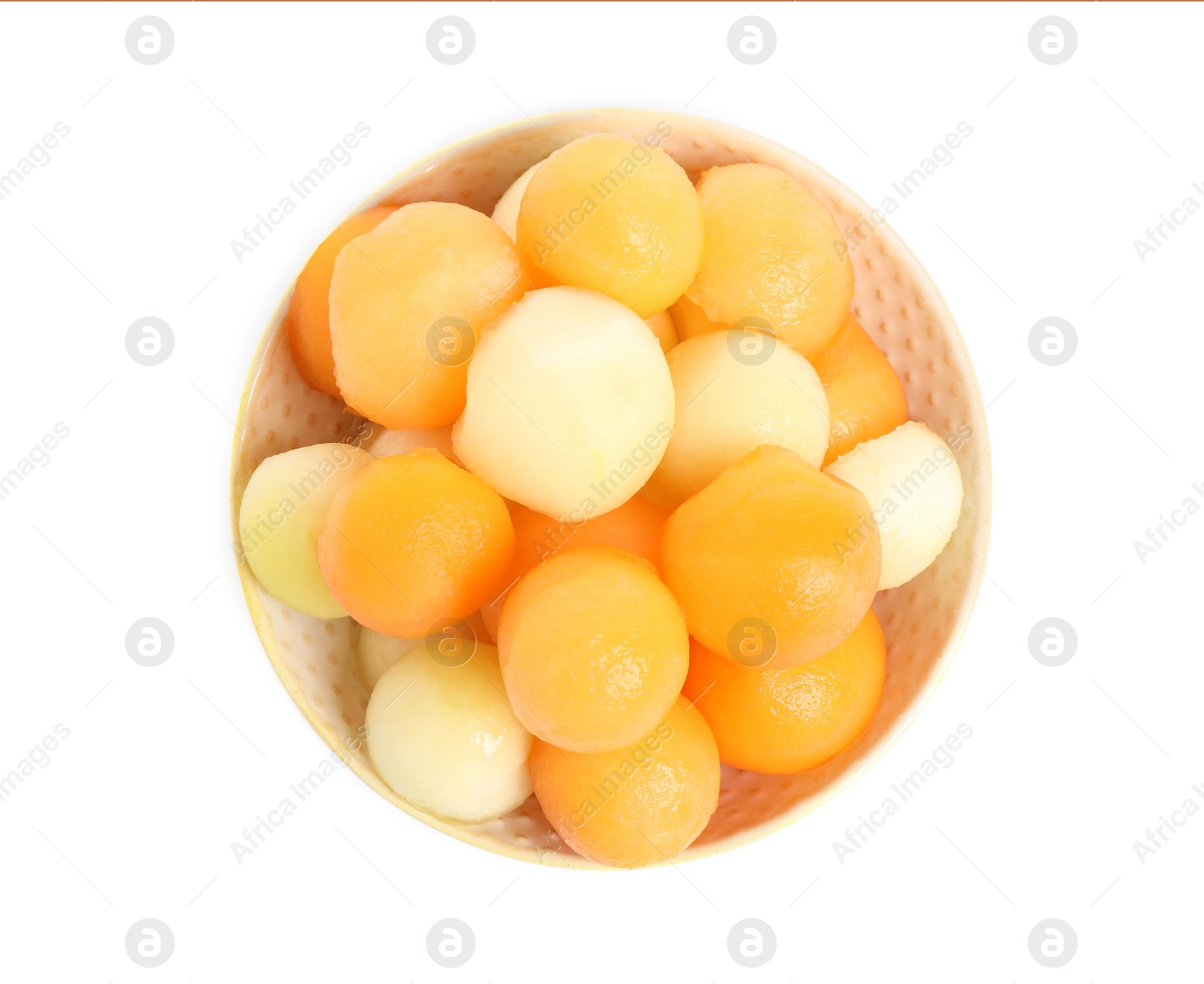 Photo of Melon balls in bowl isolated on white, top view