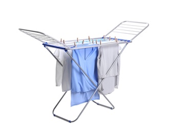 Photo of Clean laundry hanging on drying rack against white background