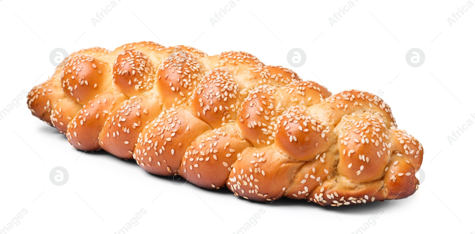 Photo of Homemade braided bread with sesame seeds isolated on white. Traditional Shabbat challah