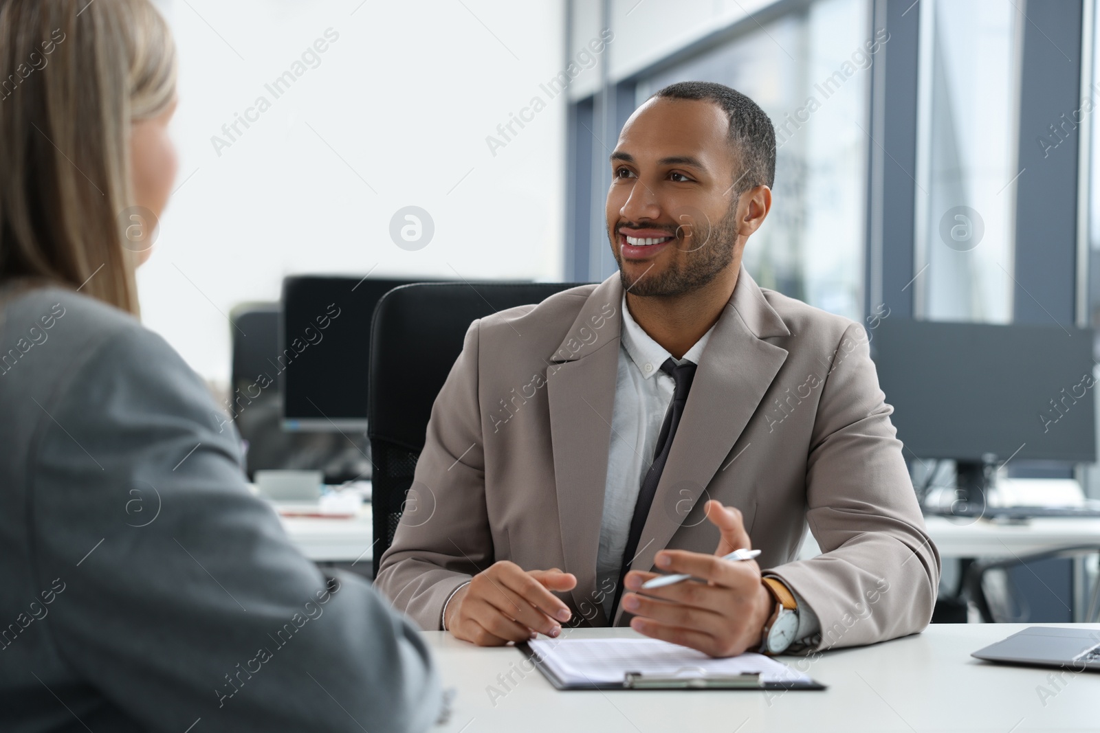 Photo of Lawyers working together at table in office