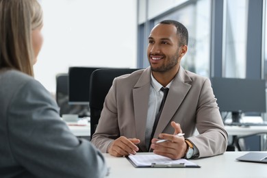 Lawyers working together at table in office