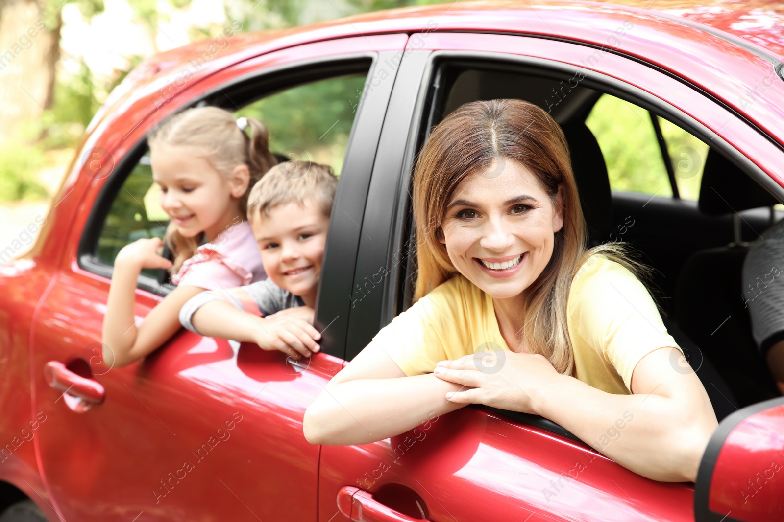 Photo of Happy family with children taking road trip together