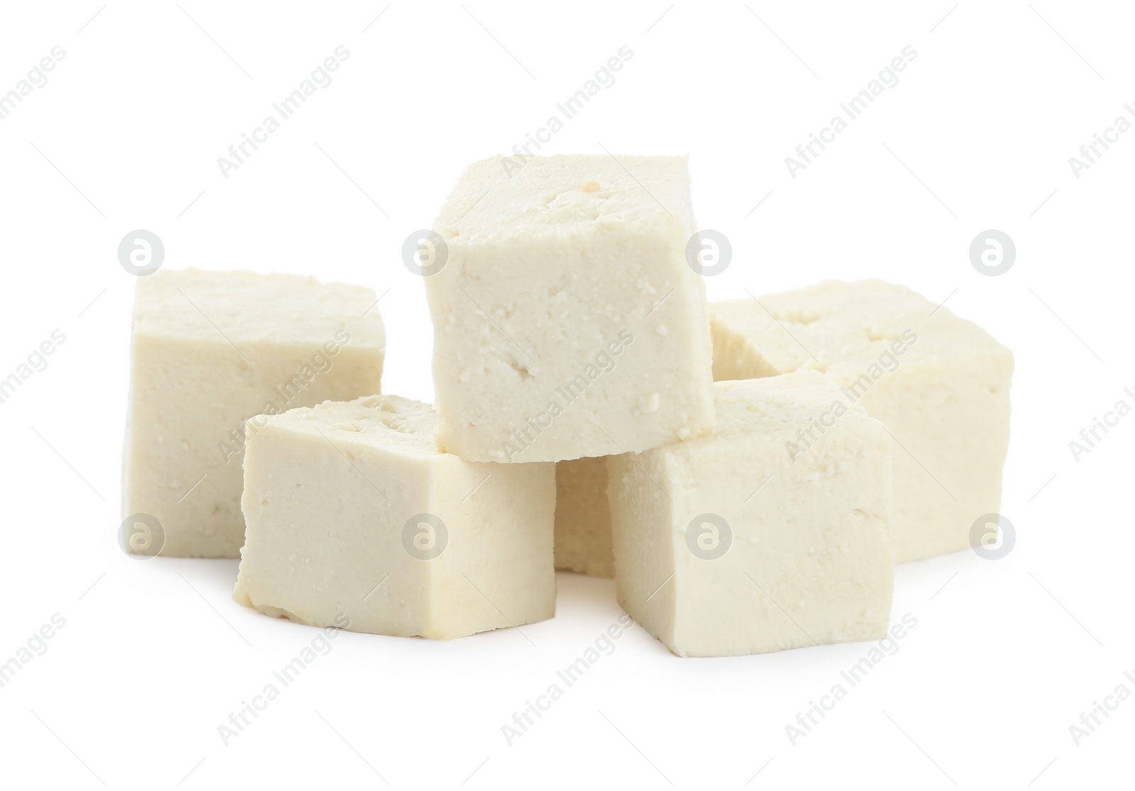 Photo of Pieces of delicious tofu on white background. Soybean curd