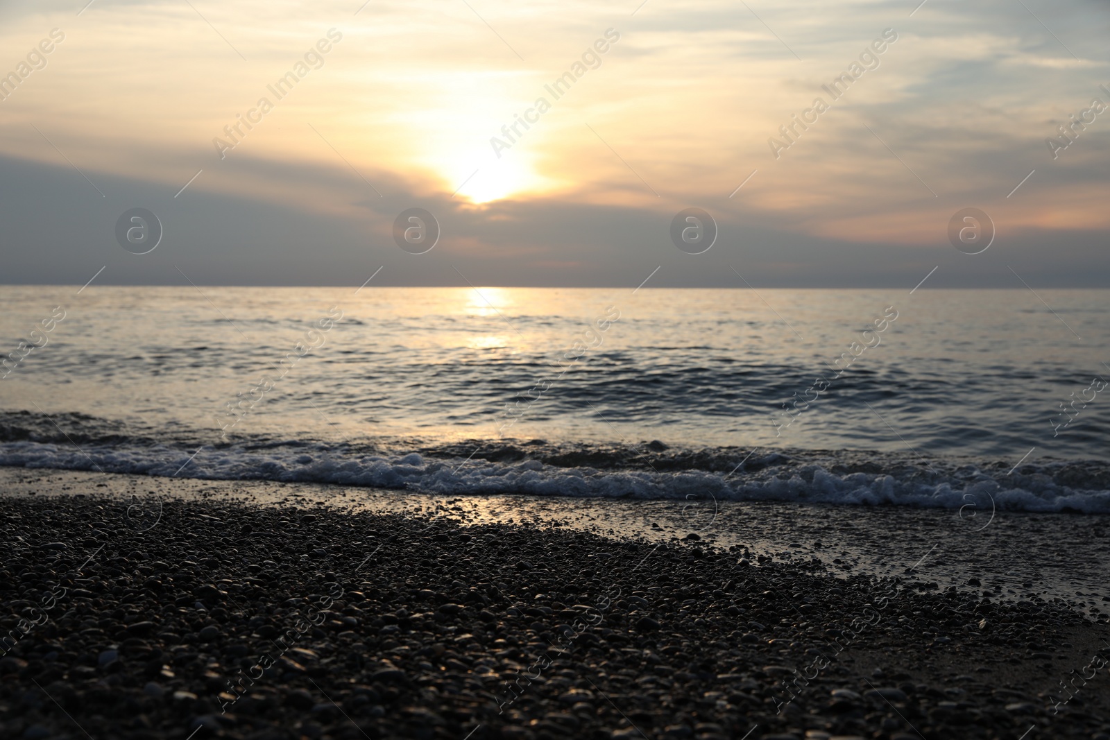 Photo of Picturesque view of sea and tropical beach at sunset