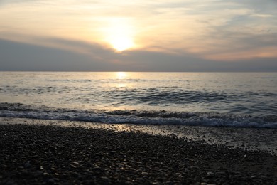 Picturesque view of sea and tropical beach at sunset