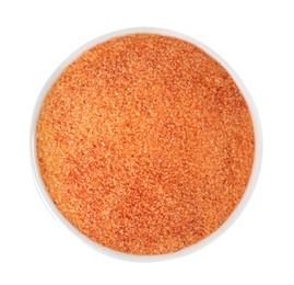 Orange salt in bowl isolated on white, top view