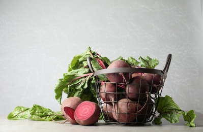 Fresh ripe beets on light grey table