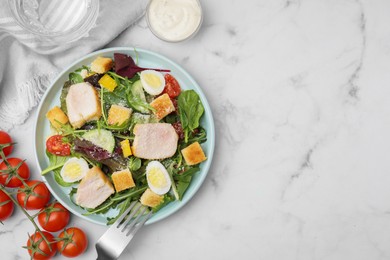 Photo of Delicious salad with croutons, chicken and eggs served on white marble table, flat lay. Space for text