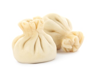 Photo of Boiled dumplings with tasty filling on white background